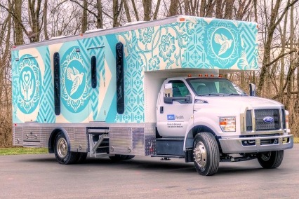 Blue and white health clinic vehicle for the NIH-funded INTEGRA study.
