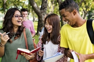college students laughing together on a campus